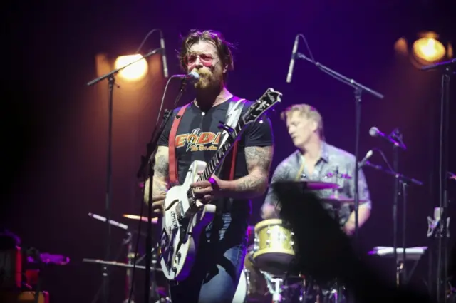 US musician and lead singer of the band "Eagles of Death Metal" Jesse Hughes performs during a concert at the Olympia music venue in Paris