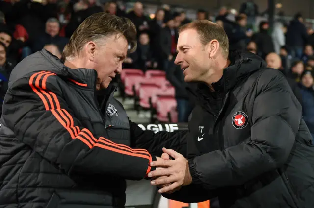 Louis van Gaal and Jess Thorup, the two managers, shake hands