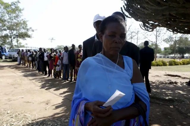 An elderly woman queue at a polling station during the presidential elections in Kirihura in western Uganda