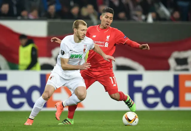 Ragnar Klavan of Augsburg and Roberto Firmino