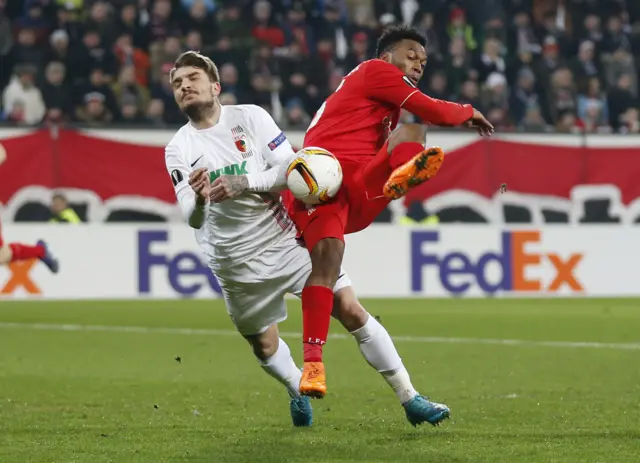 Daniel Sturridge and Augsburg's Kostas Stafylidis in action