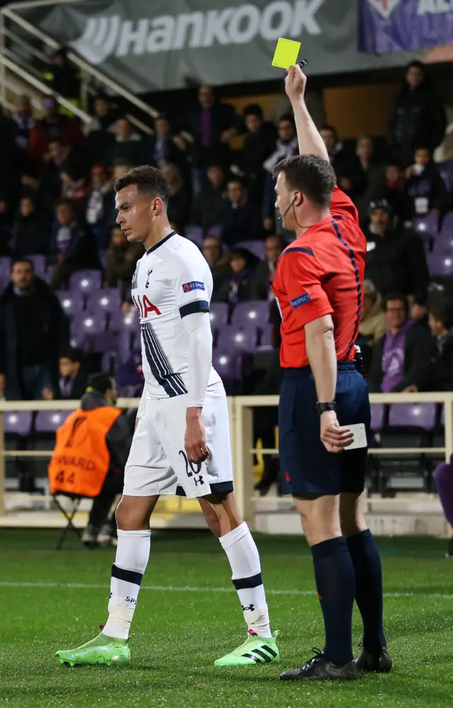 Dele Alli gets shown a yellow card