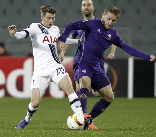 Jakub Blaszczykowski is challenged by Tottenham's Tom Carrol