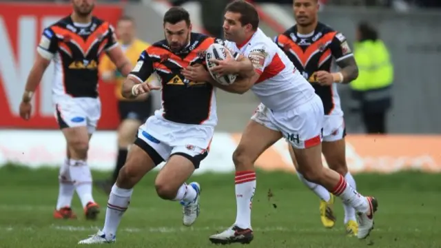 Castleford Tigers Matt Cook is tackled by Hull KR's Maurice Blair