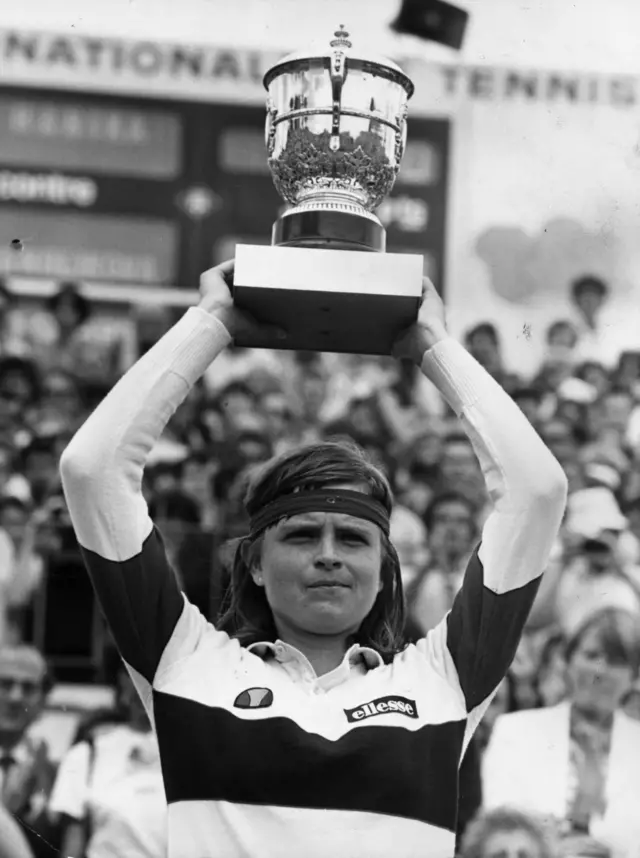 Czech tennis player Hana Mandlikova holding her trophy aloft after winning the Women's Singles title at the French Open tennis