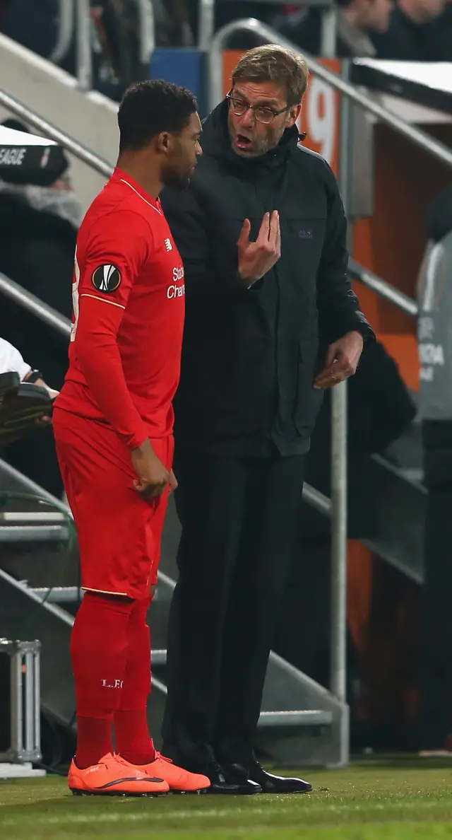 Jordon Ibe waits on the touchline with Jurgen Klopp