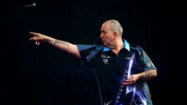 Phil Taylor throwing a dart