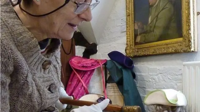 Volunteer Annemarie Powell with David Garrick's walking stick