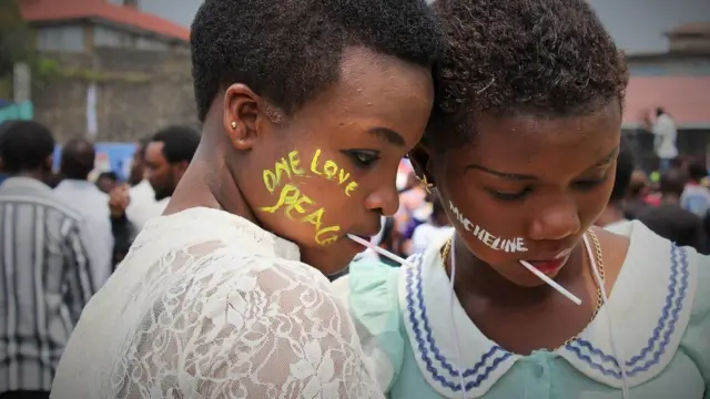 One love written on cheek