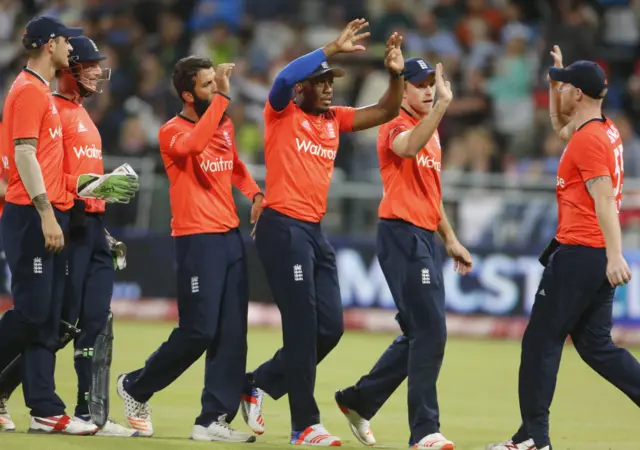 England's players celebrate a wicket