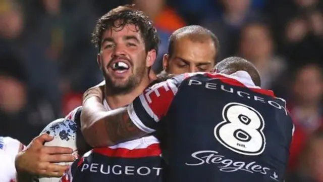 Aiden Guerra celebrates his try with Sydney Roosters' team-mate Kane Evans