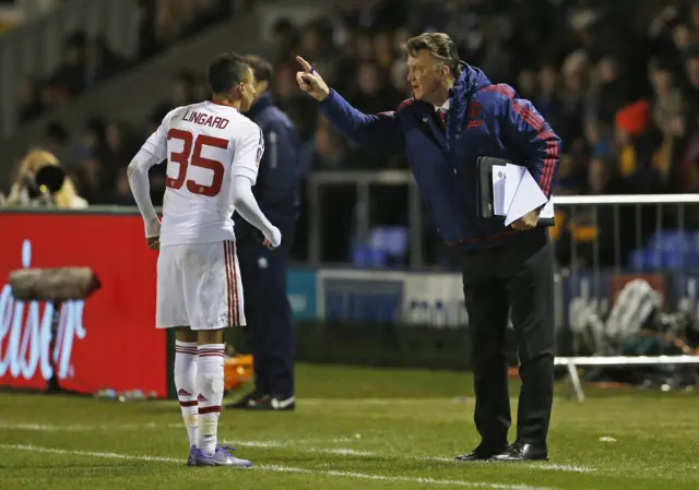 Jesse Lingard talks with Louis van Gaal