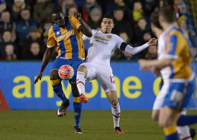 Jermaine Grandison vies with Chris Smalling