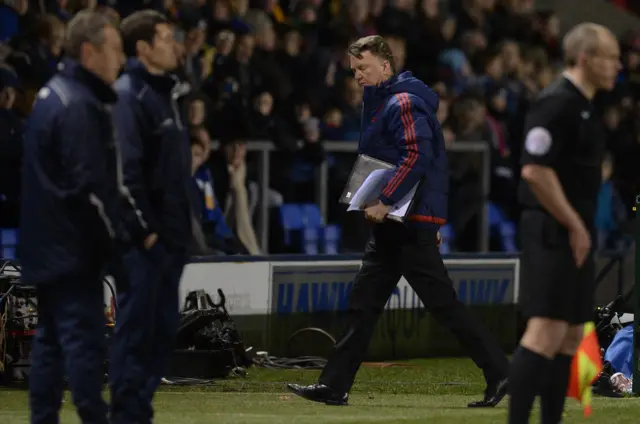 Louis van Gaal heads to the dug out after the match