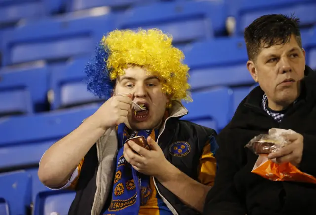 Shrewsbury Town fans fill up on pie ahead of the match