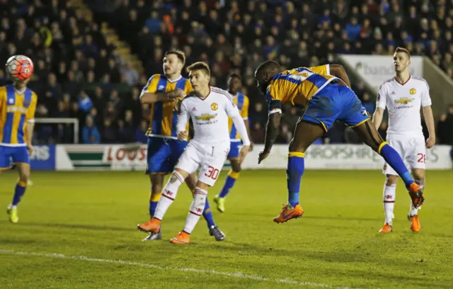 Abu Ogogo heads at goal