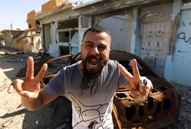 A Libyan man celebrating victory over militants in Benghazi