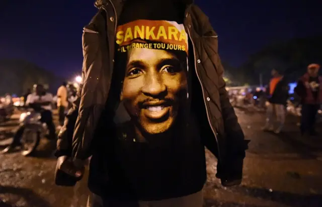 man wears a shirt depicting former Bukinabe President Thomas Sankara and meaning 'He is still unsettling' in Bobo Dioulasso, after a protest against de military coup on September 18, 2015