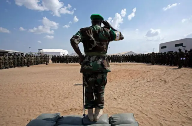 File picture dated 24 October 2007 shows General Martin Luther Agwai, commander of the African Union Mission in Sudan (AMIS) and soon-to-be deployed AU-UN Hybrid force UNAMID, salutes at newly arrived Nigerian protection force peacekeepers at the Mission Group Site (MGS) in Graida, southern Darfur