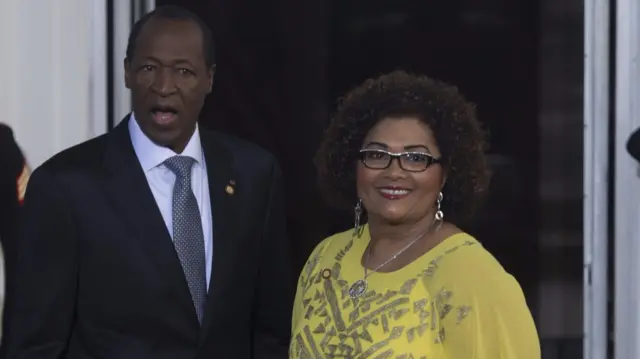 Burkina Faso President Blaise Compaore arrives with his wife Chantal Compaore at the White House for a group dinner during the US Africa Leaders Summit August 5, 2014 in Washington,