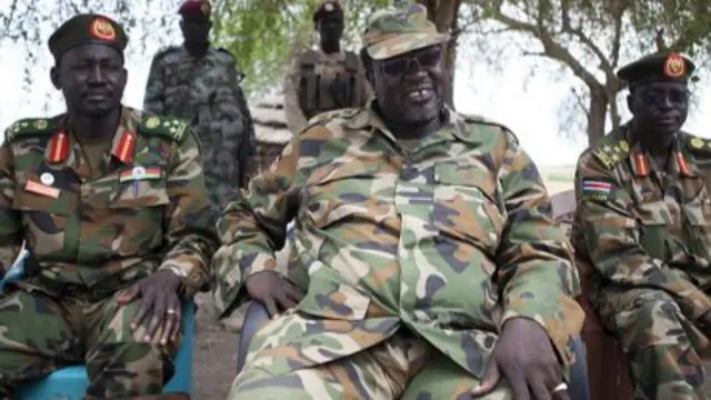 South Sudanese rebel leader and former vice president Riek Machar (C) sits in an army barracks in South Sudan's Upper Nile State on April 14, 2014