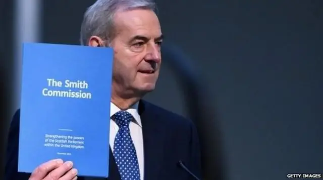 Lord Smith holds the Smith Commission report