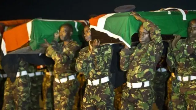 Kenyan soldiers holding a coffin