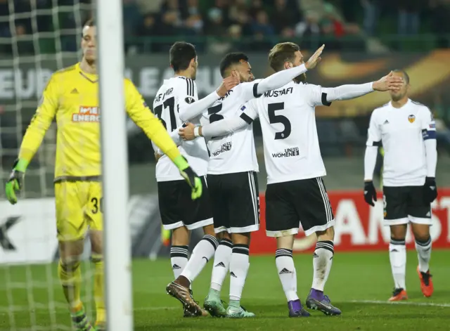 Valencia's players celebrate a goal against Rapid Vienna