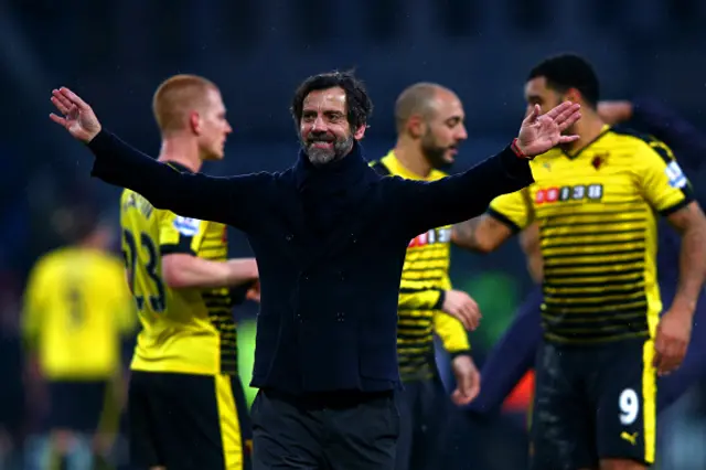 Watford manager Quique Flores with his players