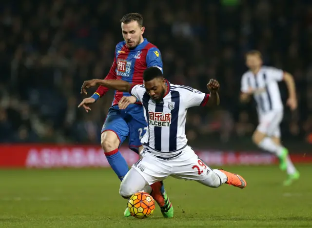 Palace's Jordan Mutch and Albion's Stephane Sessegnon battle for the ball