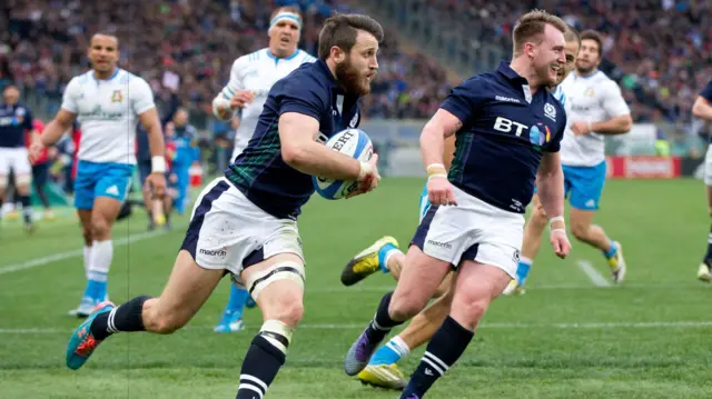 Tommy Seymour scores Scotland's final try while Stuart Hogg looks on