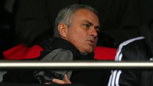 Jose Mourinho watches on