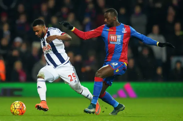 Yannick Bolasie of Crystal Palace takes on Stephane Sessegnon