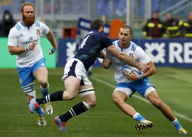 Mattia Bellini and Tommy Seymour in a full-blooded tackle