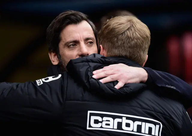 Quique Flores hugs his opposition manager