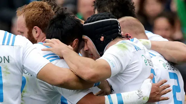 Italy players celebrate Leonardo Ghiraldino's try