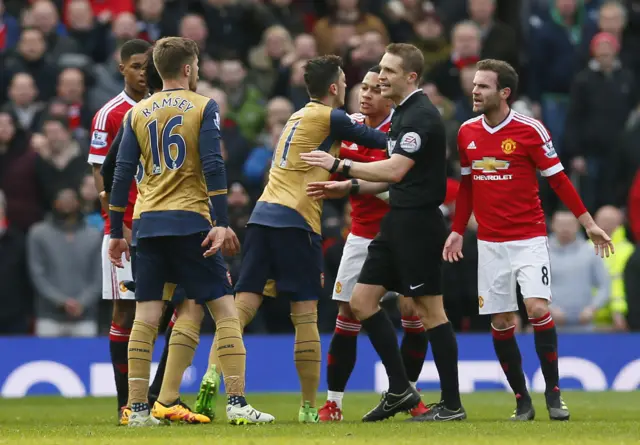 Aaron Ramsey clashes with Manchester United's Memphis Depay