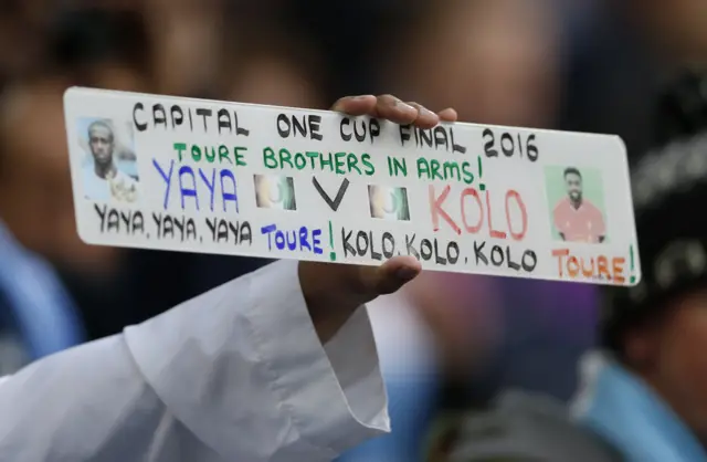 Yaya Toure and Kolo Toure sign