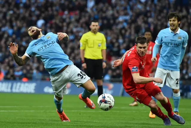 Nicolas Otamendi and James Milner