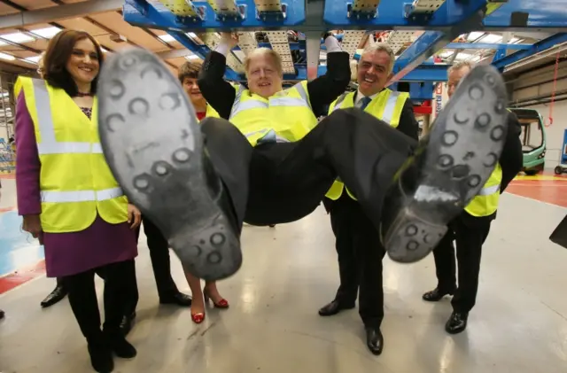 Boris Johnson and Theresa Villiers during a visit to the Wrightbus factory