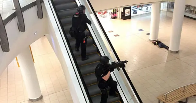 Two police officers with guns