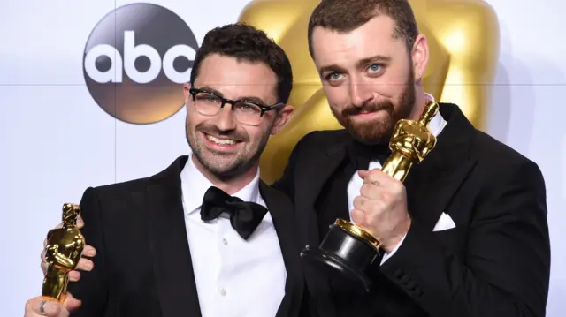 Jimmy Napes (L) and Sam Smith pose with the Oscar for Best Original Song, Writing's on the Wall from Spectre