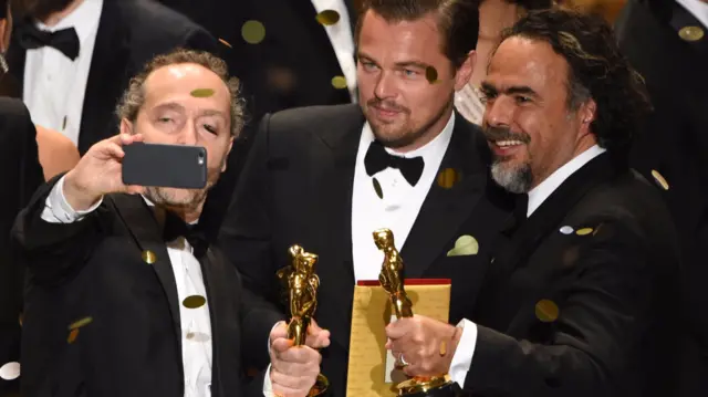 Cinematographer Emmanuel Lubezki, actor Leonardo DiCaprio and Director Alejandro Inarritu with their Oscars for The Revenant