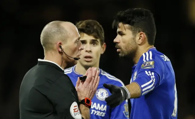 Diego Costa speaks with the referee