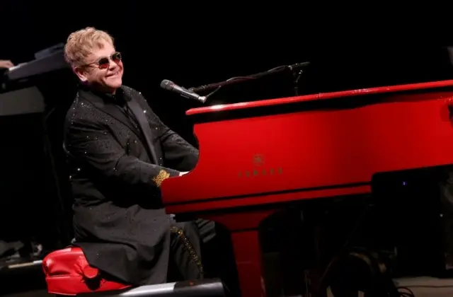 Elton John playing piano