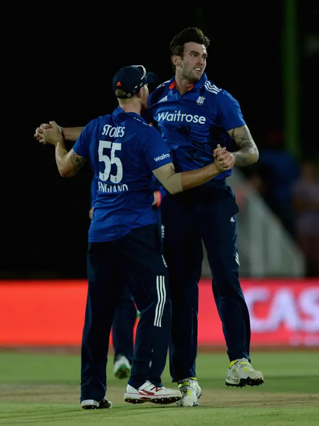 Reece Topley celebrates with Ben Stokes