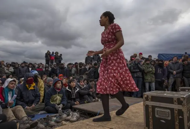 Actors from Shakespeare's Globe perform Hamlet to migrants at the Good Chance Theatre Tent in the Jungle Refugee Camp