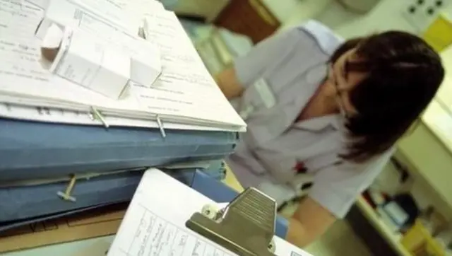 Nurse dealing with paperwork