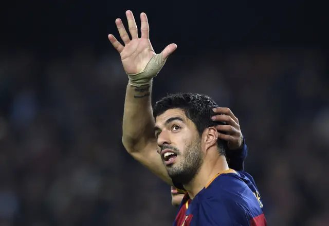 Luis Suarez celebrates scoring a hat-trick against Valencia in the Copa Del Rey semi final