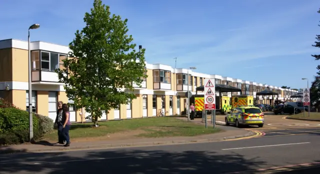 The Queen Elizabeth Hospital, with ambulances outside